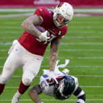 Arizona Cardinals tight end Maxx Williams (87) avoids the tackle of Philadelphia Eagles strong safety Jalen Mills (21) during the first half of an NFL football game, Sunday, Dec. 20, 2020, in Glendale, Ariz. (AP Photo/Rick Scuteri)