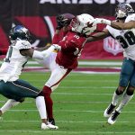Arizona Cardinals wide receiver DeAndre Hopkins (10) pulls in a catch as Philadelphia Eagles defensive back Michael Jacquet (38) and cornerback Kevon Seymour (41) defend during the first half of an NFL football game, Sunday, Dec. 20, 2020, in Glendale, Ariz. (AP Photo/Ross D. Franklin)