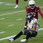 Philadelphia Eagles safety Marcus Epps (22) intercepts a pass as Arizona Cardinals wide receiver DeAndre Hopkins (10) defends during the second half of an NFL football game, Sunday, Dec. 20, 2020, in Glendale, Ariz. (AP Photo/Ross D. Franklin)