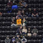 Utah Jazz fans watch during the second half of the team's NBA basketball game against the Phoenix Suns on Thursday, Dec. 31, 2020, in Salt Lake City. (AP Photo/Rick Bowmer)