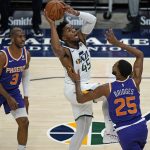 Utah Jazz guard Donovan Mitchell (45) goes to the basket as Phoenix Suns forward Mikal Bridges (25) defends during the first half of an NBA preseason basketball game Monday, Dec. 14, 2020, in Salt Lake City. (AP Photo/Rick Bowmer)