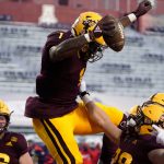 Arizona State running back DeaMonte Trayanum (1) celebrates with Case Hatch after scoring a touchdown against Arizona during the first half of an NCAA college football game Friday, Dec. 11, 2020, in Tucson, Ariz. (AP Photo/Rick Scuteri)