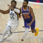 Utah Jazz guard Donovan Mitchell (45) drives as Phoenix Suns forward Mikal Bridges (25) defends during the first half of an NBA preseason basketball game Monday, Dec. 14, 2020, in Salt Lake City. (AP Photo/Rick Bowmer)