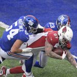 Arizona Cardinals' Maxx Williams (87), center, tries to get the ball into the end zone during the second half of an NFL football game against the New York Giants, Sunday, Dec. 13, 2020, in East Rutherford, N.J. (AP Photo/Bill Kostroun)