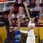 Arizona State guard Alonzo Verge Jr., right, shoots over San Diego State forward Matt Mitchell during the second half of an NCAA college basketball game Thursday, Dec. 10, 2020, in Tempe, Ariz. San Diego State won 80-68. (AP Photo/Ross D. Franklin)