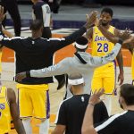 The Los Angeles Lakers celebrate during the second half of a preseason NBA basketball game against the Phoenix Suns, Friday, Dec. 18, 2020, in Phoenix, Ariz. The Lakers won 114-113. (AP Photo/Matt York)