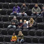Utah Jazz fans watch the first half of the team's NBA preseason basketball game against the Phoenix Suns on Saturday, Dec. 12, 2020, in Salt Lake City. (AP Photo/Rick Bowmer)