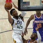 Utah Jazz guard Donovan Mitchell (45) goes to the basket as Phoenix Suns' Chris Paul defends during the first half of an NBA preseason basketball game Monday, Dec. 14, 2020, in Salt Lake City. (AP Photo/Rick Bowmer)