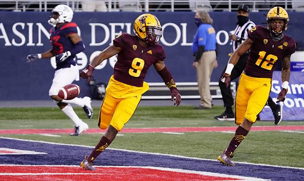 Arizona State's D.J. Taylor (9) scores a touchdown against Arizona on a kick return during the firs...