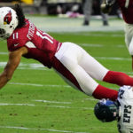 Arizona Cardinals wide receiver Larry Fitzgerald (11) is tackled by Philadelphia Eagles safety Marcus Epps (22) during the first half of an NFL football game, Sunday, Dec. 20, 2020, in Glendale, Ariz. (AP Photo/Rick Scuteri)