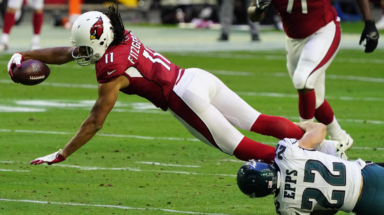 Arizona Cardinals wide receiver Larry Fitzgerald (11) is tackled by Philadelphia Eagles safety Marc...