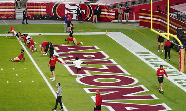 San Francisco 49ers players stretch prior to an NFL football game against the Buffalo Bills, Monday...