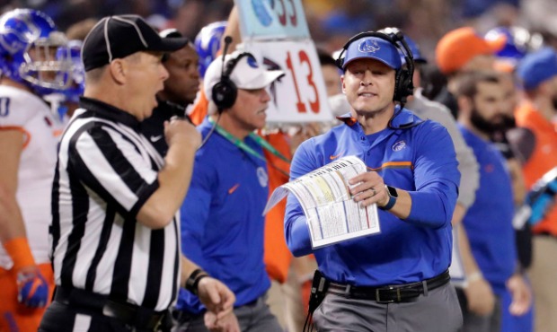 Boise State coach Bryan Harsin yells to an official during the first half of the Cactus Bowl NCAA c...