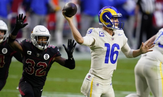 Los Angeles Rams quarterback Jared Goff (16) throws as Arizona Cardinals strong safety Budda Baker ...