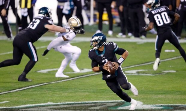 Quarterback Jalen Hurts #2 of the Philadelphia Eagles rolls out to pass against the New Orleans Sai...