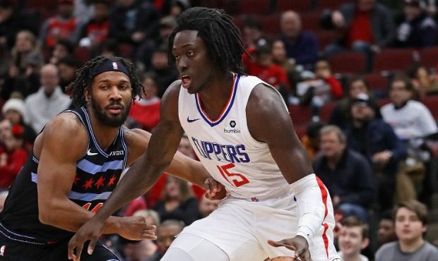Johnathan Motley #15 of the LA Clippers moves past Wayne Selden #14 of the Chicago Bulls at the Uni...