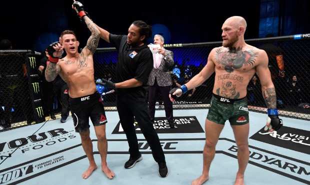 In this handout image provided by the UFC, Dustin Poirier reacts after his knockout victory over Co...