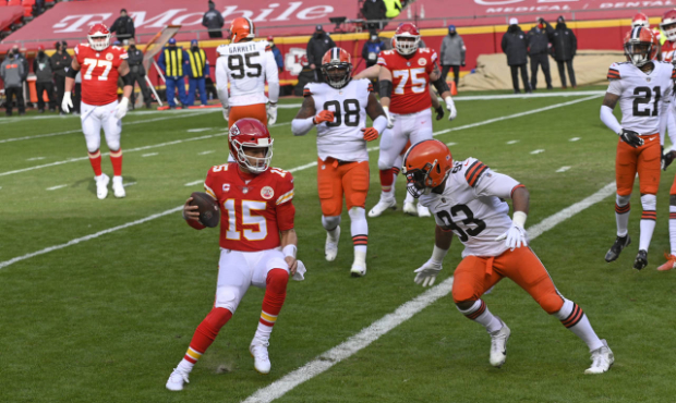 Kansas City Chiefs quarterback Patrick Mahomes (15) scores on a touchdown run during the first half...