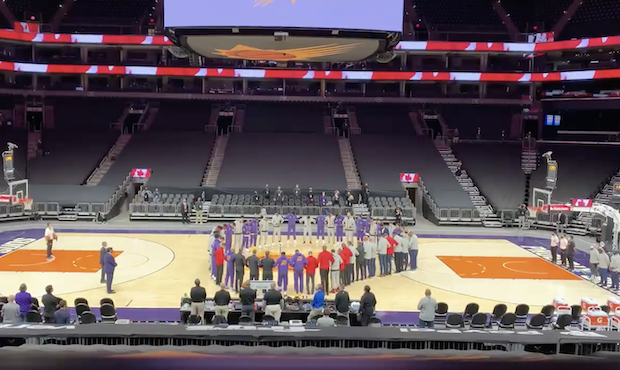 Suns, Raptors link arms in circle at center court for both national anthems