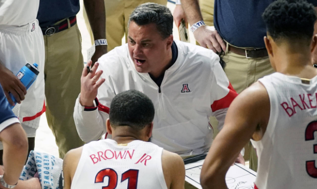 Arizona coach Sean Miller talks to the team during the second half of an NCAA college basketball ga...