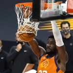Phoenix Suns center Deandre Ayton dunks against the Denver Nuggets during the second half of an NBA basketball game Friday, Jan. 22, 2021, in Phoenix. (AP Photo/Rick Scuteri)