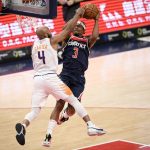Phoenix Suns guard Jevon Carter (4) fouls Washington Wizards guard Bradley Beal (3) during the second half of an NBA basketball game, Monday, Jan. 11, 2021, in Washington. (AP Photo/Nick Wass)