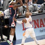 Washington Wizards guard Bradley Beal (3) shoots against Phoenix Suns guard Jevon Carter (4) during the first half of an NBA basketball game, Monday, Jan. 11, 2021, in Washington. (AP Photo/Nick Wass)