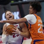 Detroit Pistons forward Blake Griffin (23) is fouled by Phoenix Suns forward Cameron Johnson (23) during the second half of an NBA basketball game, Friday, Jan. 8, 2021, in Detroit. (AP Photo/Carlos Osorio)