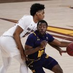 California guard Makale Foreman (10) drives by Arizona State guard Josh Christopher, who tries to knock the ball away during the second half of an NCAA college basketball game Thursday, Jan. 28, 2021, in Tempe, Ariz. Arizona State won 72-68. (AP Photo/Rick Scuteri)