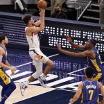 Phoenix Suns' Devin Booker (1) shoots against Indiana Pacers' Myles Turner (33) during the second half of an NBA basketball game, Saturday, Jan. 9, 2021, in Indianapolis. (AP Photo/Darron Cummings)
