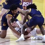 Arizona State forward Chris Osten (21) struggles for the ball with California forward Andre Kelly and guard Joel Brown (1) during the second half of an NCAA college basketball game, Thursday, Jan. 28, 2021, in Tempe, Ariz. Arizona State won 72-68. (AP Photo/Rick Scuteri)