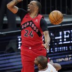Toronto Raptors guard Norman Powell (24) grimaces after being fouled by Phoenix Suns guard Chris Paul (3) during the second half of an NBA basketball game Wednesday, Jan. 6, 2021, in Phoenix. The Suns defeated the Raptors 123-115. (AP Photo/Ross D. Franklin)