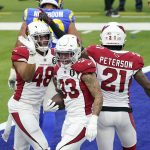 Arizona Cardinals cornerback Byron Murphy (33) celebrates his fumble recovery with linebacker Isaiah Simmons (48) and cornerback Patrick Peterson (21) during the first half of an NFL football game Sunday, Jan. 3, 2021, in Inglewood, Calif. (AP Photo/Ashley Landis)