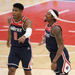 Washington Wizards guard Bradley Beal, right, reacts with forward Rui Hachimura (8) during the second half of an NBA basketball game against the Phoenix Suns, Monday, Jan. 11, 2021, in Washington. (AP Photo/Nick Wass)