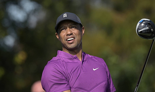This Dec. 19, 2020, file photo shows Tiger Woods watching his tee shot on the first hole during the...