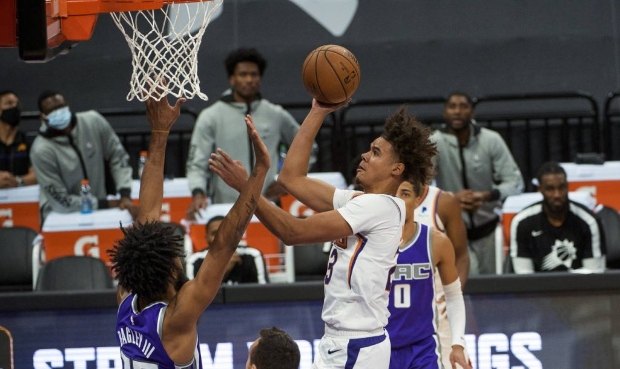 Phoenix Suns forward Cameron Johnson (23) is fouled by Sacramento Kings forward Marvin Bagley III (...