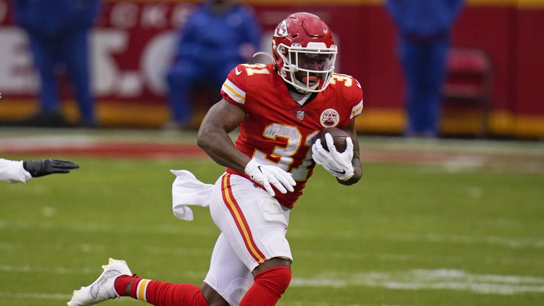 Kansas City Chiefs running back Darrel Williams carries the ball up field during the second half of...