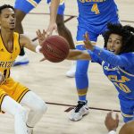 Arizona State guard Alonzo Verge Jr., left, passes the ball as UCLA guard Tyger Campbell (10) defends during the first half of an NCAA college basketball game Thursday, Jan. 7, 2021, in Tempe, Ariz. (AP Photo/Ross D. Franklin)