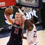 Washington Wizards center Moritz Wagner (21) goes to the basket against Phoenix Suns center Deandre Ayton (22) during the second half of an NBA basketball game, Monday, Jan. 11, 2021, in Washington. (AP Photo/Nick Wass)