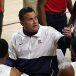Arizona coach Sean Miller talks to the team during a timeout in the first half of the team's NCAA college basketball game against Arizona State, Thursday, Dec. 21, 2021, in Tempe, Ariz. (AP Photo/Rick Scuteri)