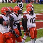 Cleveland Browns safety Karl Joseph (42) celebrates with teammates after intercepting a pass during the second half of an NFL divisional round football game against the Kansas City Chiefs, Sunday, Jan. 17, 2021, in Kansas City. (AP Photo/Charlie Riedel)
