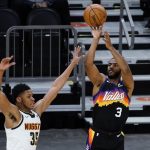 Phoenix Suns guard Chris Paul (3) shoots over Denver Nuggets guard PJ Dozier during the second half of an NBA basketball game Saturday, Jan. 23, 2021, in Phoenix. (AP Photo/Rick Scuteri)