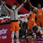 Phoenix Suns guard Cameron Payne (15), forward Cameron Johnson (23) and others celebrate after a three-point basket by a teammate during the first half of an NBA basketball game against the Detroit Pistons, Friday, Jan. 8, 2021, in Detroit. (AP Photo/Carlos Osorio)