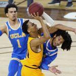 Arizona State guard Alonzo Verge Jr., middle, tries to get off a shot as UCLA guard Tyger Campbell, right, defends and guard Jules Bernard (1) watches during the first half of an NCAA college basketball game Thursday, Jan. 7, 2021, in Tempe, Ariz. (AP Photo/Ross D. Franklin)