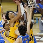 Arizona State forward Marcus Bagley, left, gets off a shot over UCLA guard Jaime Jaquez Jr. (4) during the first half of an NCAA college basketball game Thursday, Jan. 7, 2021, in Tempe, Ariz. (AP Photo/Ross D. Franklin)