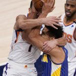 Indiana Pacers' Malcolm Brogdon (7) is fouled by Phoenix Suns' Devin Booker (1) as he goes up to shoot during the second half of an NBA basketball game, Saturday, Jan. 9, 2021, in Indianapolis. (AP Photo/Darron Cummings)