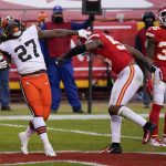 Cleveland Browns running back Kareem Hunt (27) celebrates in front of Kansas City Chiefs linebacker Anthony Hitchens, right, after scoring on a 3-yard touchdown run during the second half of an NFL divisional round football game, Sunday, Jan. 17, 2021, in Kansas City. (AP Photo/Jeff Roberson)