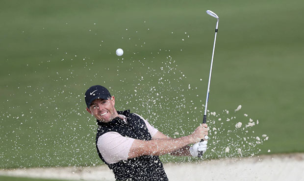 Rory McIlroy hits out of the bunker on the second hole during the final round of the Masters golf t...