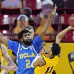 
              UCLA forward Cody Riley (2) defends against a shot from Arizona State guard Alonzo Verge Jr. (11) during the second half of an NCAA college basketball game Thursday, Jan. 7, 2021, in Tempe, Ariz. UCLA won 81-75 in overtime. (AP Photo/Ross D. Franklin)
            