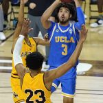 UCLA guard Johnny Juzang (3) shoots in front of Arizona State forward Marcus Bagley (23) and guard Alonzo Verge Jr., left, during the second half of an NCAA college basketball game Thursday, Jan. 7, 2021, in Tempe, Ariz. (AP Photo/Ross D. Franklin)